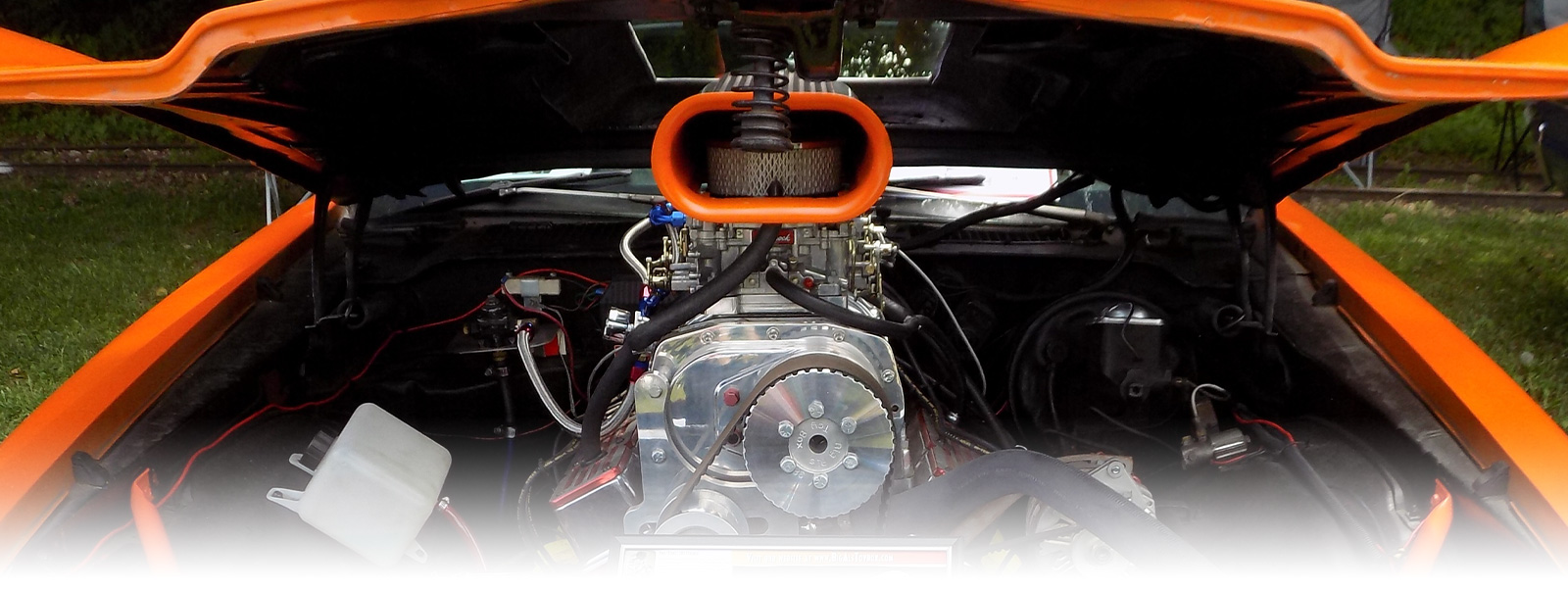 Orange Classic Car Showing Engine